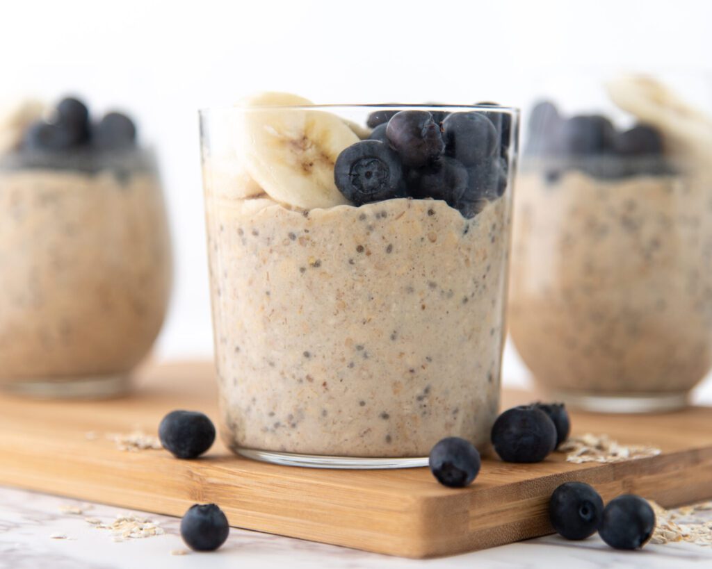 Overnight oats in a glass jar topped with blueberries